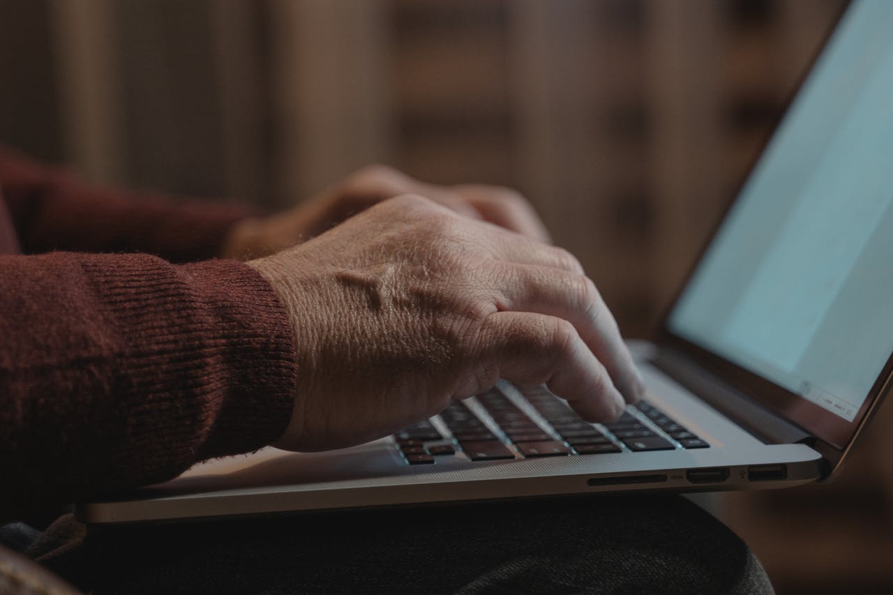 home-hero Close-up of hands typing on a laptop keyboard, ideal for business and technology themes.